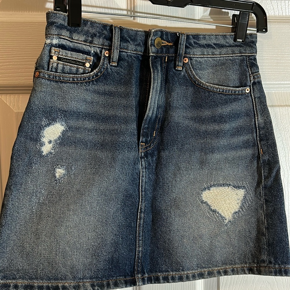 Calvin Klein Jeans distressed denim skirt.